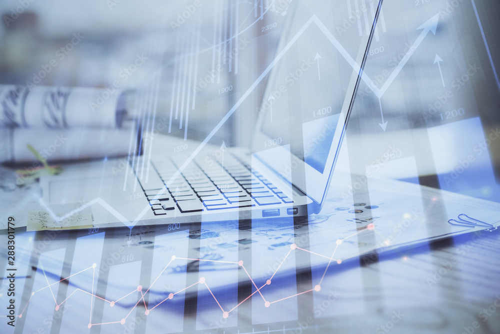 Stock market graph and table with computer background. Double exposure. Concept of financial analysis. Stock market graph and table with computer background. Double exposure. Concept of financial analysis.