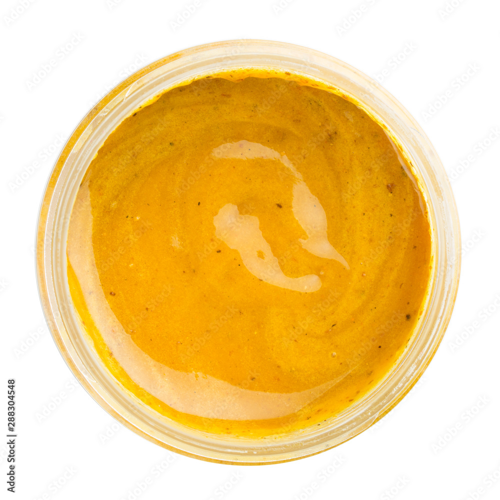 Top view of the jar of honey with turmeric and ginger Top view of the jar of honey with turmeric and ginger