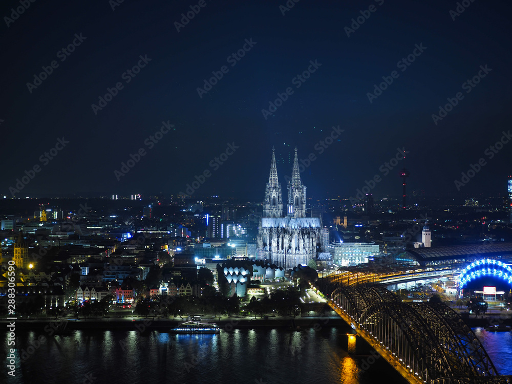 Aerial night view of St Peter Cathedral and Hohenzollern Bridge