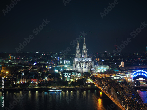 Aerial night view of St Peter Cathedral and Hohenzollern Bridge