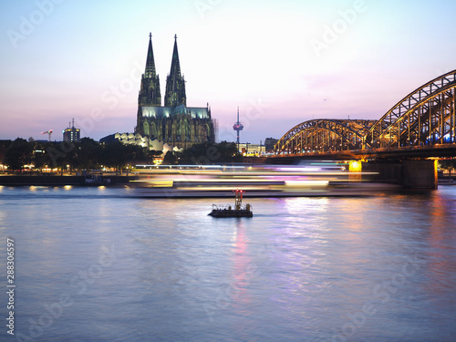 St Peter Cathedral and Hohenzollern Bridge over river Rhine in K photo