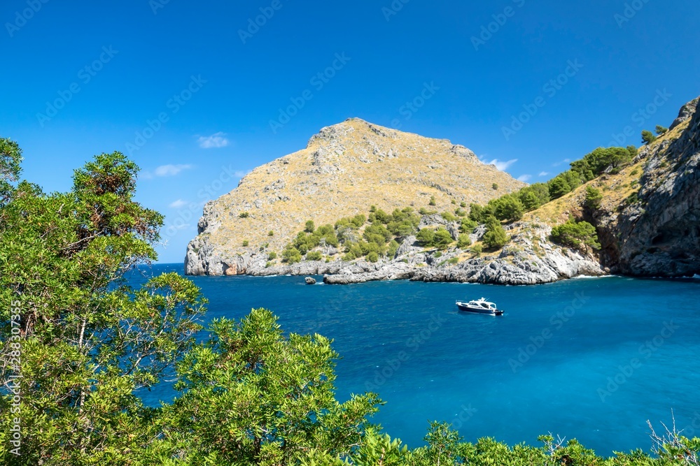  a beautiful bay, mallorca spain. Blue background and write space