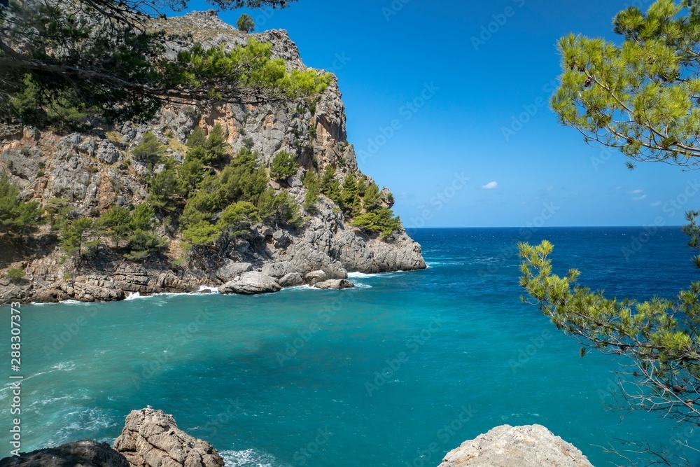 a beautiful bay, mallorca spain. Blue background and write space