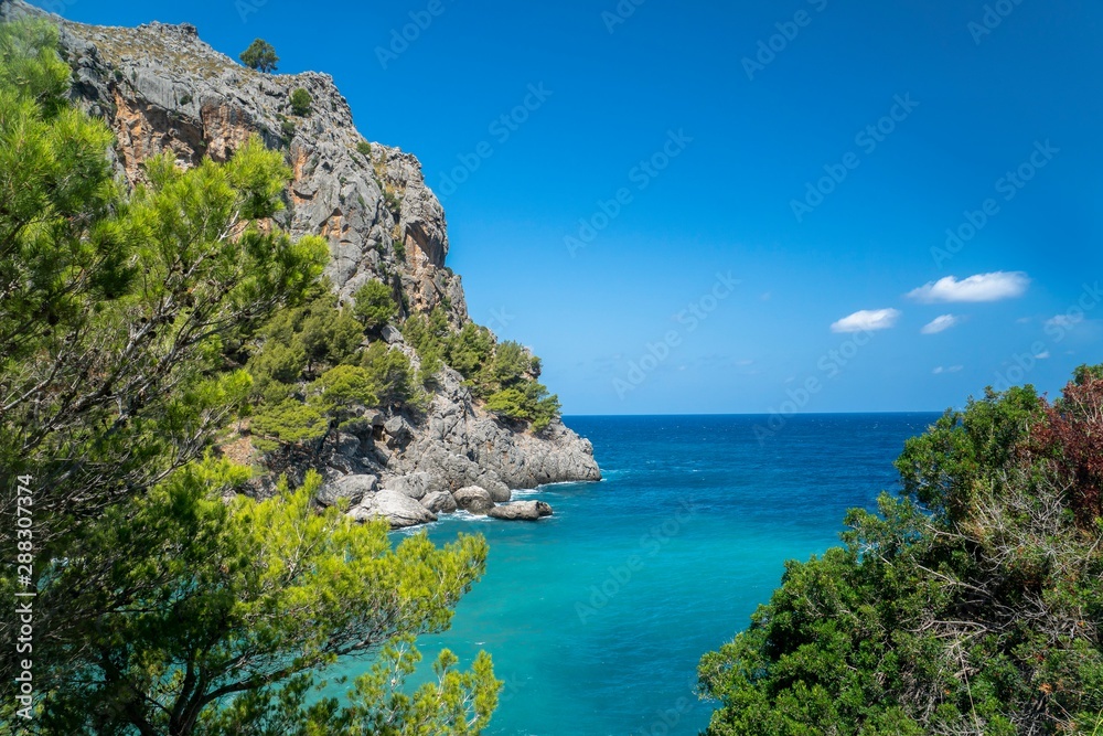  a beautiful bay, mallorca spain. Blue background and write space