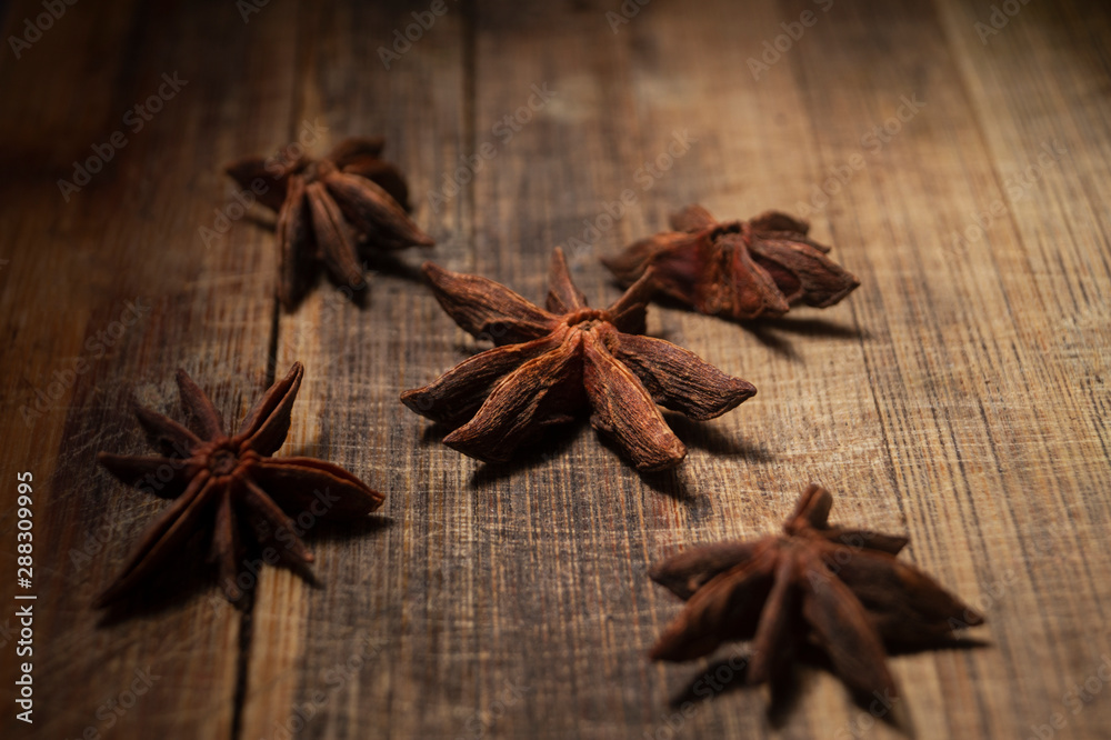 STAR ANISE ON WOODEN BACKGROUND, MACRO PHOTOGRAPHY OF GARAM MASALA ON WOODEN TEXTURE BACKGROUND, STAR ANISE ON WOODEN BACKGROUND, MACRO PHOTOGRAPHY OF GARAM MASALA ON WOODEN TEXTURE BACKGROUND,