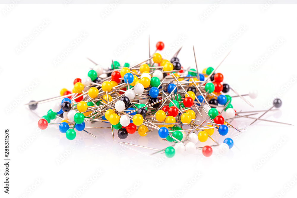 Colored pushpins on white background Colored pushpins on white background