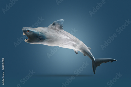 Creative concept background by photo of shark ( toy model) and transparent plastic bags.Environmentalism and . plastic awareness,with clipping path.