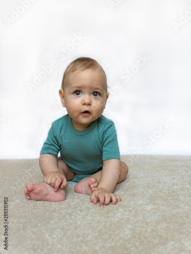 Sweet little baby boy portrait on white background