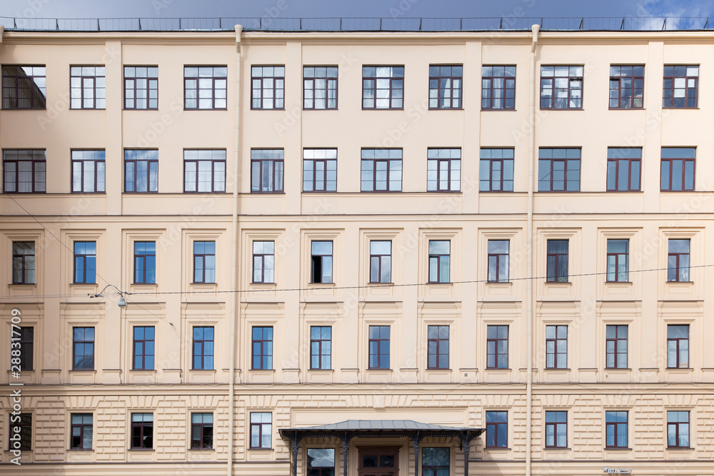 windows and details on an exterior of the building. windows and details on an exterior of the building.