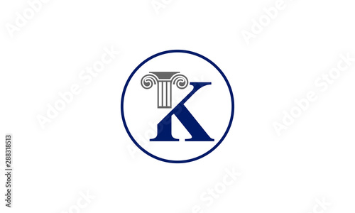 Classic ionic column capital forms letter K inside a blue circle emblem