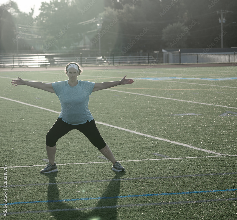 Fototapeta premium Middle Age woman stretching