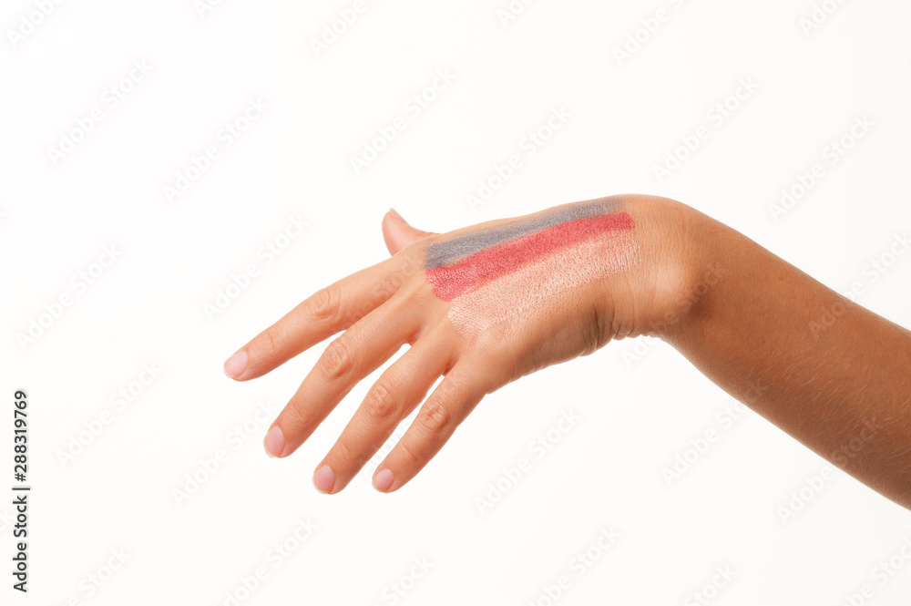 Cosmetic powder on woman hand isolated on white background. Cosmetic powder on woman hand isolated on white background.
