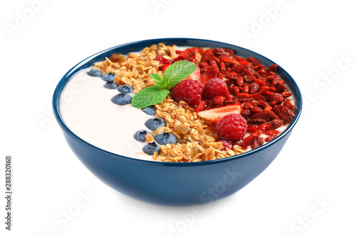 Smoothie bowl with goji berries on white background