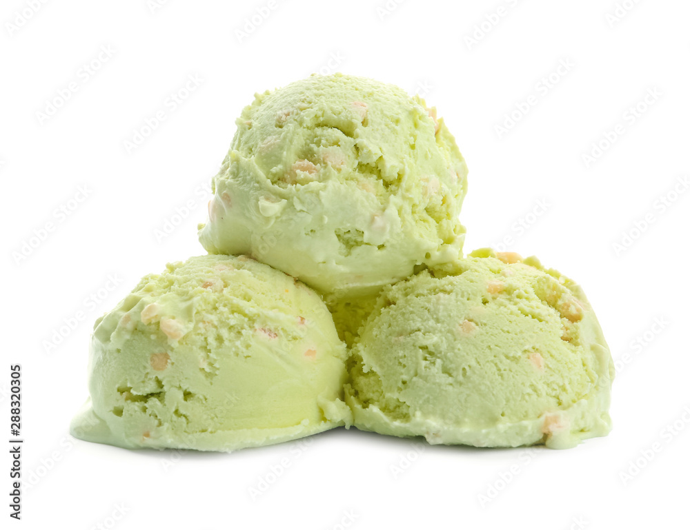 Scoops of delicious pistachio ice cream on white background