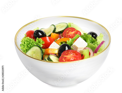 Tasty fresh Greek salad on white background