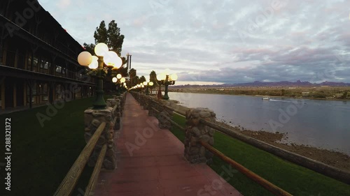 Lighted Riverwalk River And Water Taxi At Dusk- Laughlin Nevada photo