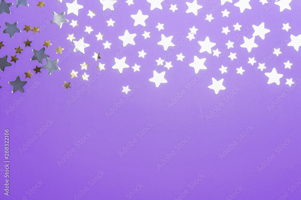 Confetti stars with space for text on violet background, top view. Christmas celebration Confetti stars with space for text on violet background, top view. Christmas celebration