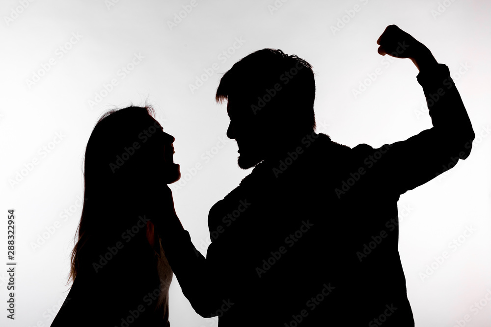 © satura_ - Domestic violence and abuse concept - Silhouette of man beating defenseless woman © satura_ - Domestic violence and abuse concept - Silhouette of man beating defenseless woman
