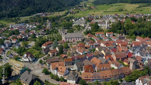 Aerial view of the old town of Zell am Harmersbach in Germany on a sunny day in summer. Pan to the right around the old town. photo