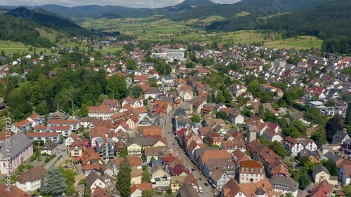 Aerial view of the old town of Zell am Harmersbach in Germany on a sunny day in summer. Pan to the right above the old town photo