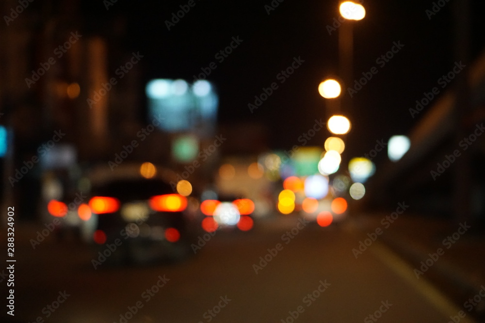 Abstract lights background. Defocused traffic night light bokeh background.