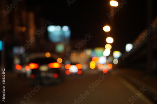 Abstract lights background. Defocused traffic night light bokeh background.
