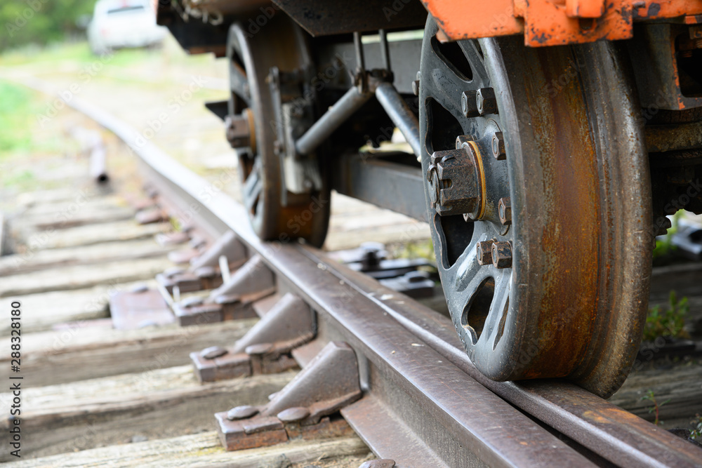 closeup of wheels on a vintage worker transport  train