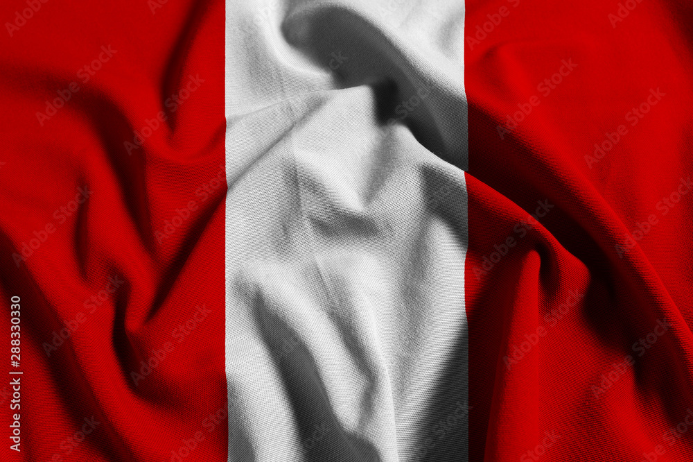National flag of Peru on a waving cotton texture background National flag of Peru on a waving cotton texture background