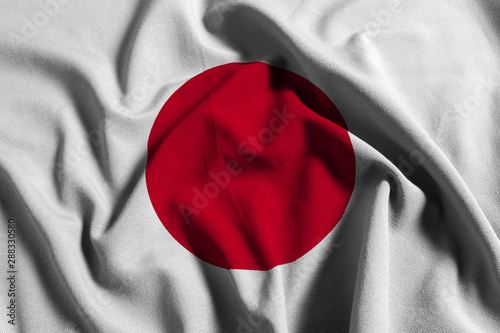 National flag of Japan on a waving cotton texture background