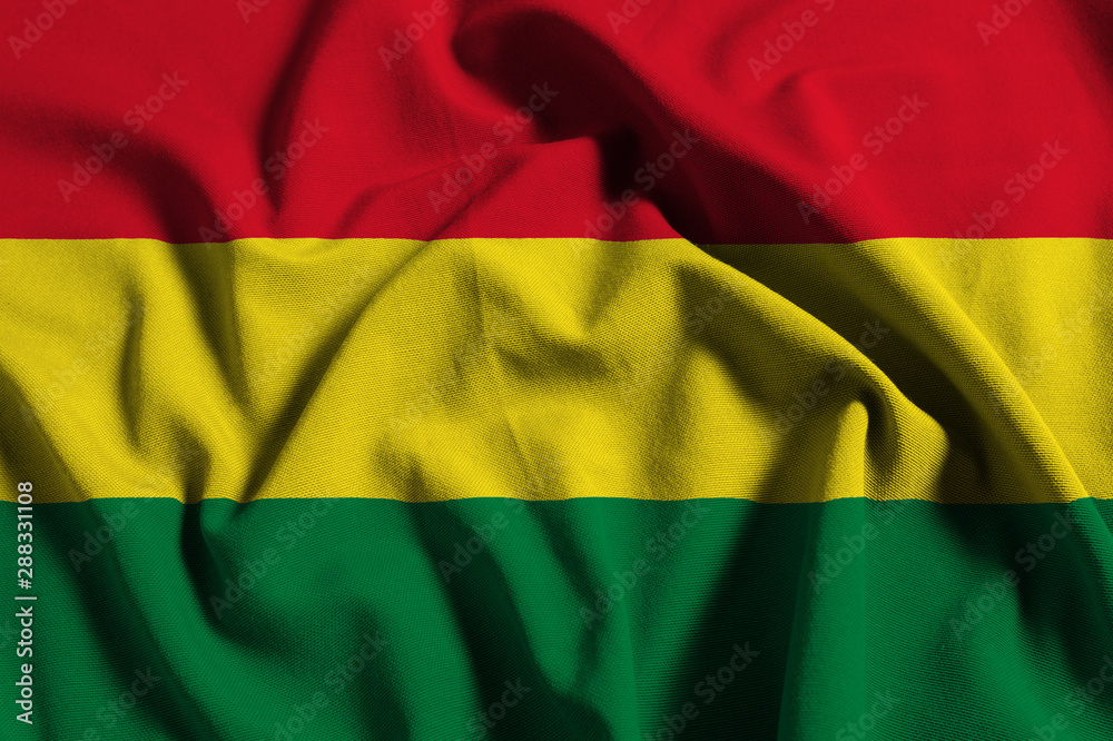 Fototapeta premium National flag of Bolivia on a waving cotton texture background