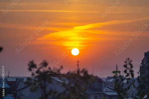 Sunrise over the city rooftops photo