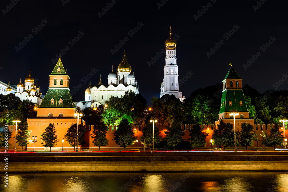 Illuminated Moscow Kremlin, Kremlin Embankment and Moscow River at night in Moscow, Russia.