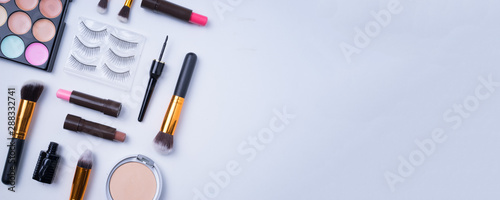 Beauty or cosmetics concept. Creative arrangement of cosmetics on white background. 