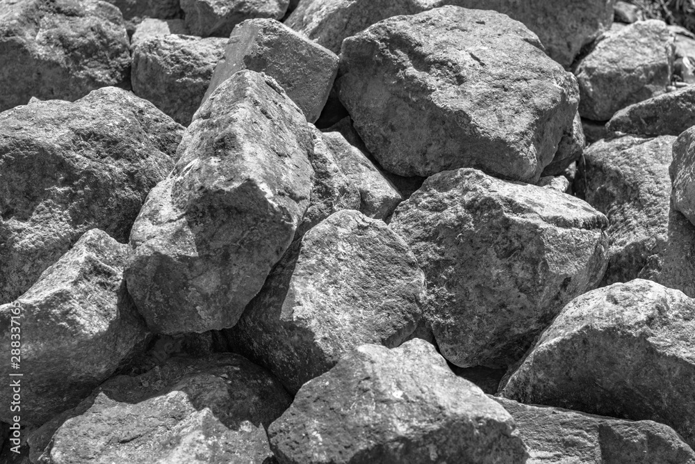 A pile of large gray stones. A lot of gray stones
