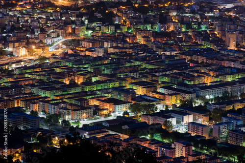 Elevated rooftop night view of La Spezia, Italy © photology1971