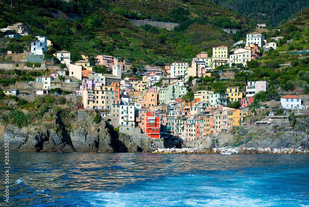 View of Riomaggiore, Italy from the sea with wake