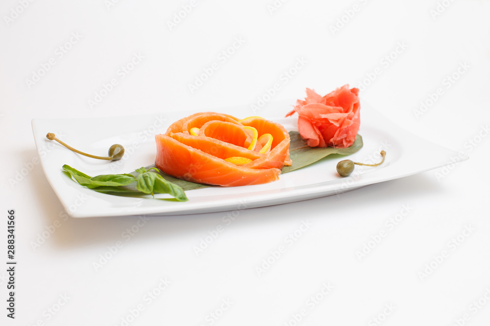 a salmon sushi on white plate a salmon sushi on white plate