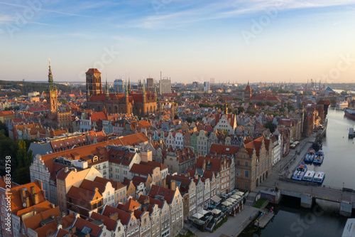 Gdansk is a city in Poland. Gdansk in the morning rays, the sun is reflected from the roofs of the old city. © slava2271