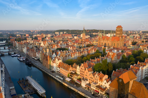 Gdansk is a city in Poland. Gdansk in the morning rays, the sun is reflected from the roofs of the old city. © slava2271