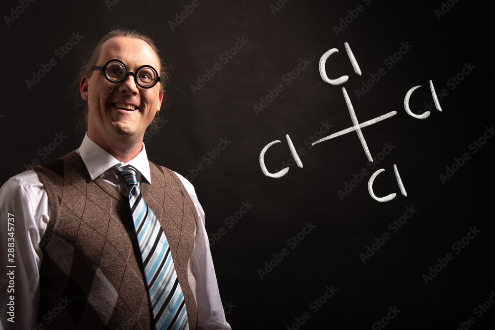 Professor presenting handdrawn chemical formula of carbon tetrachloride Professor presenting handdrawn chemical formula of carbon tetrachloride