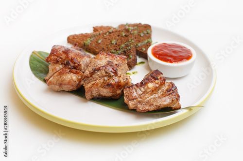 pork skewers on a stick on white background