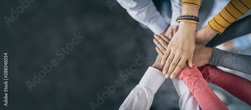Stack of hands. Unity and teamwork concept. photo