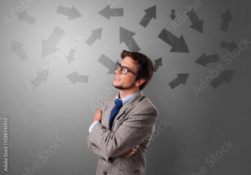 Business person choosing between several directions