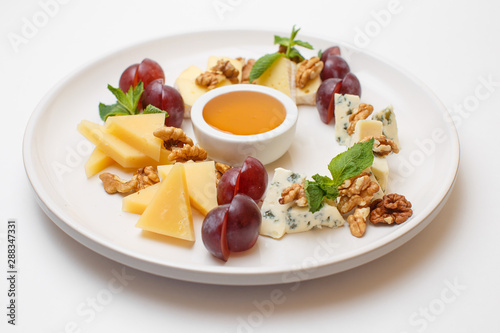 cheese plate with a honey and berries