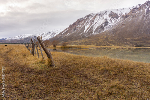 Scene view of an overcast day against snow-capped mountains during winter season in Patagonia, Argentina