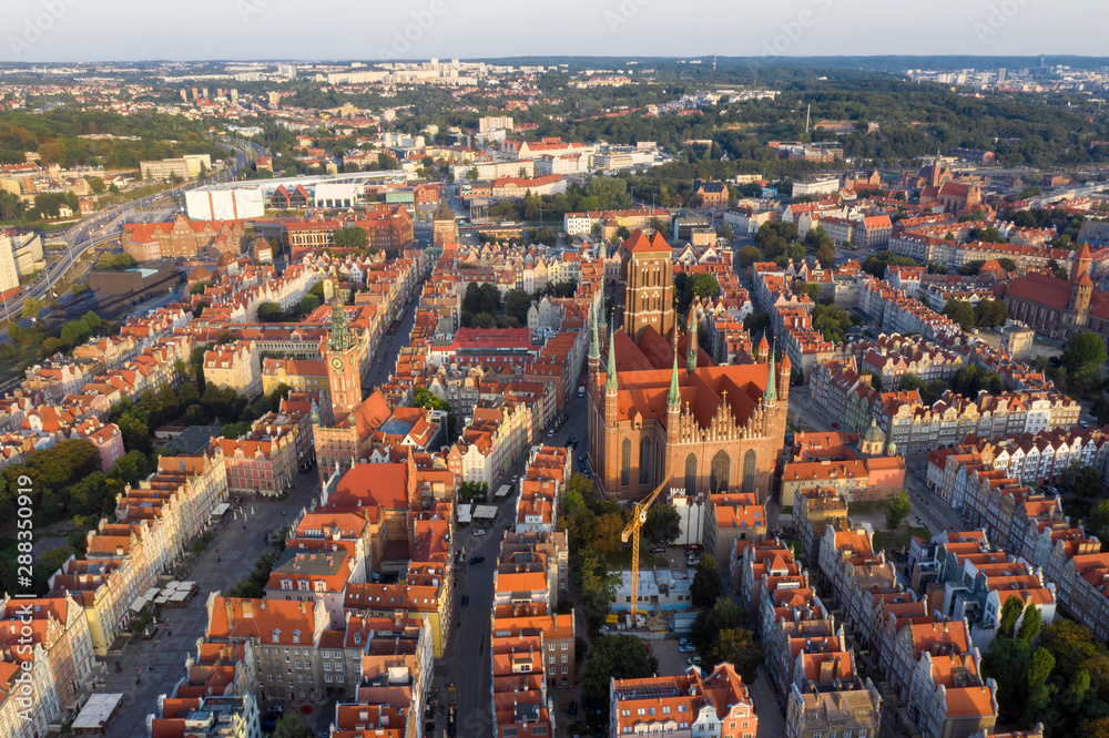 Fototapeta premium Gdansk is a city in Poland. Gdansk in the morning rays, the sun is reflected from the roofs of the old city.