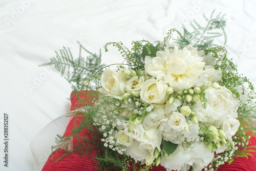 Wedding flowers Bridal bouquet of white flowers tied with a ribbon