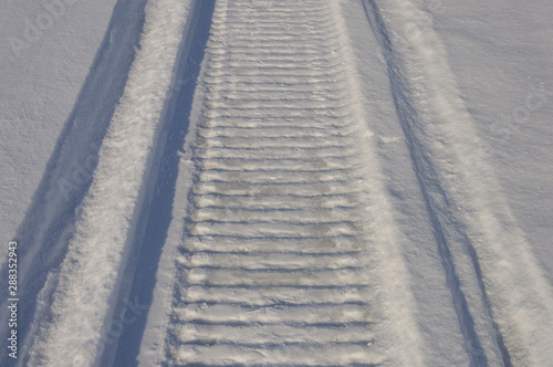 Snowmobile trace in snow