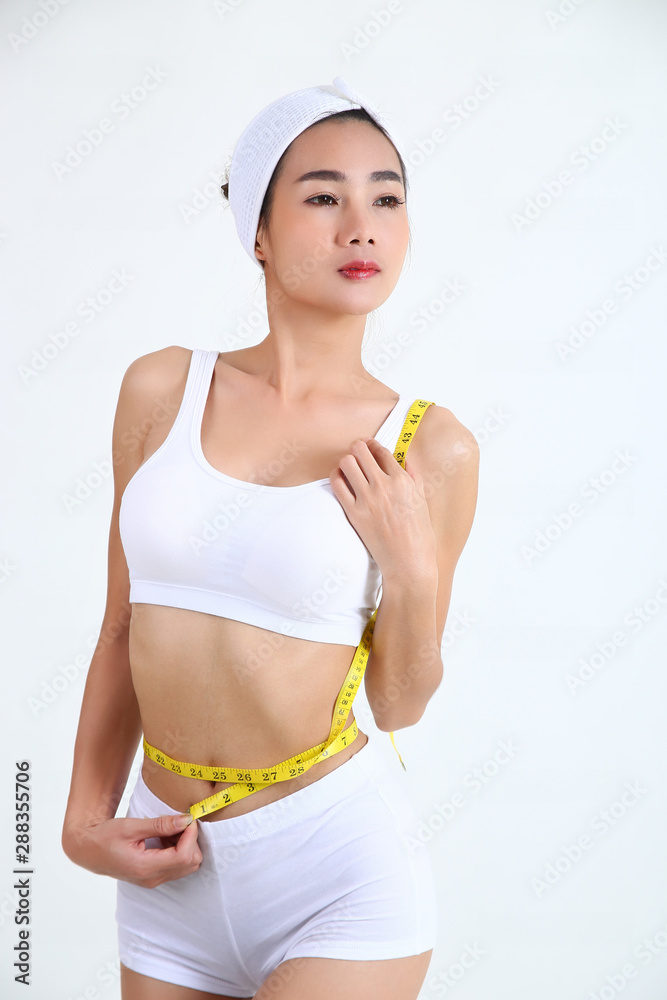 Beautiful woman posing with measure tape Beautiful woman posing with measure tape