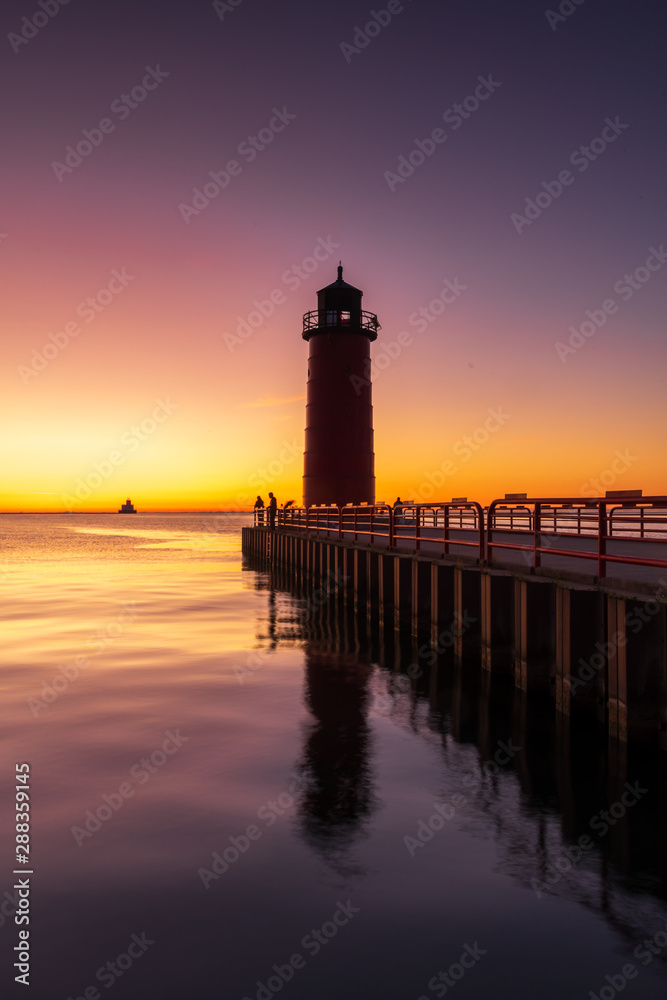 Lighthouse on Lake Michigan in Milwaukee, WI at Sunrise Lighthouse on Lake Michigan in Milwaukee, WI at Sunrise